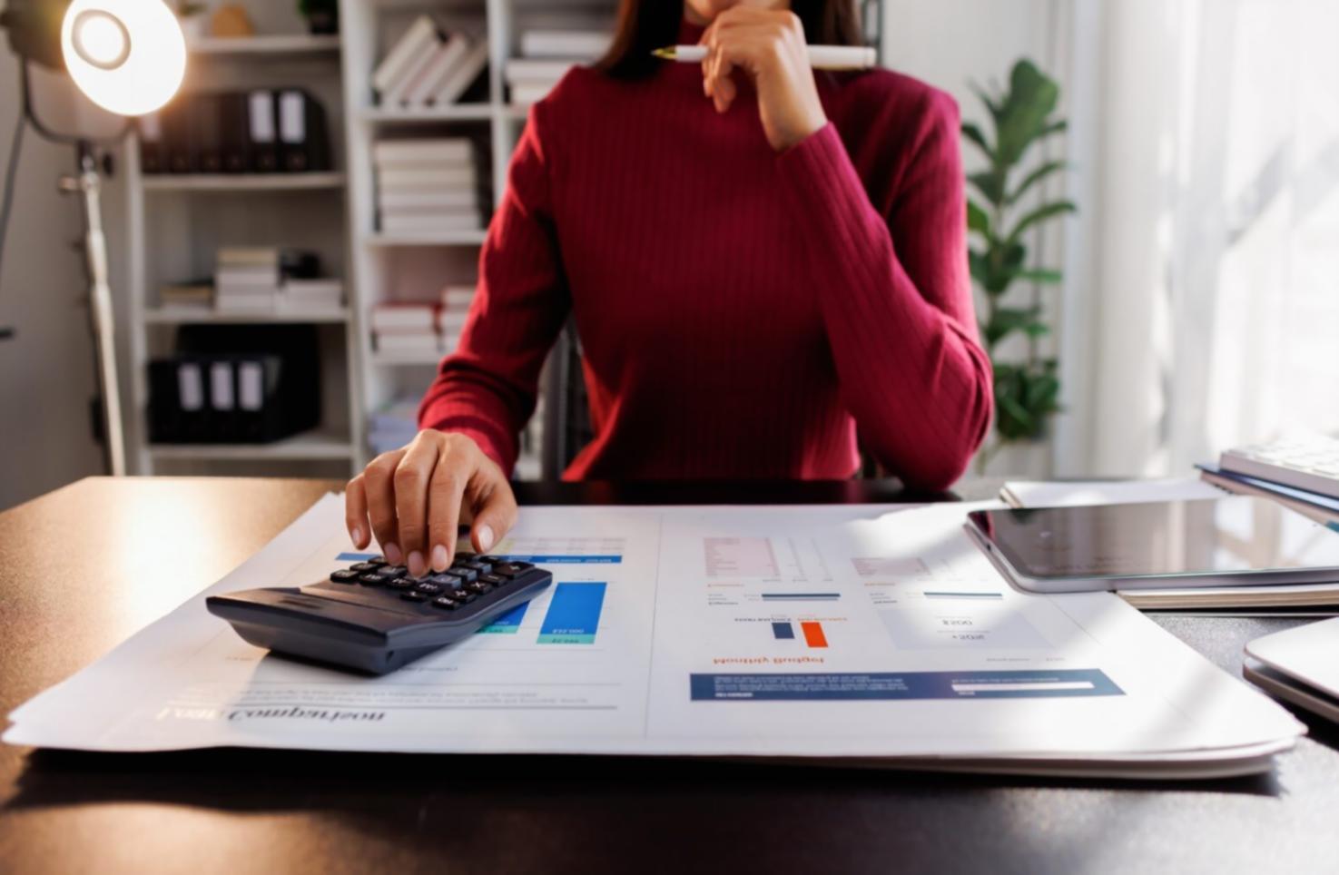 Family reviewing investment portfolio documents together at home